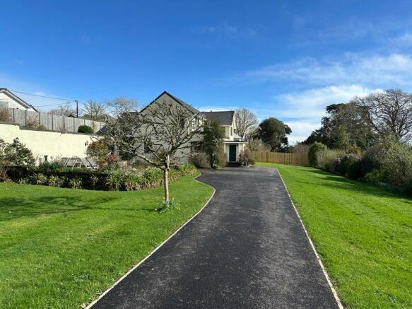 Tarmac driveway and landscaped grounds