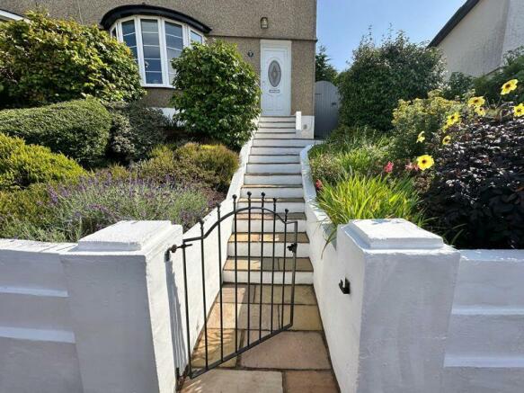 Steps through pretty front garden