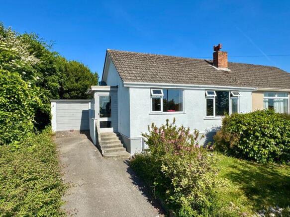 Front with driveway parking, front ga...