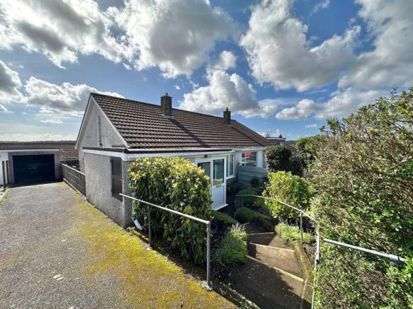 Front with driveway and garage