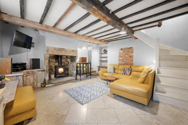 Sitting Room towards fireplace and kitchen.jpg