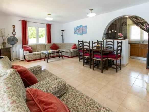 Living-dining room of villa with sea views and pool in S'Algar