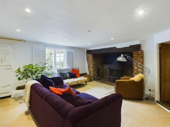 Cottage sitting room with inglenook