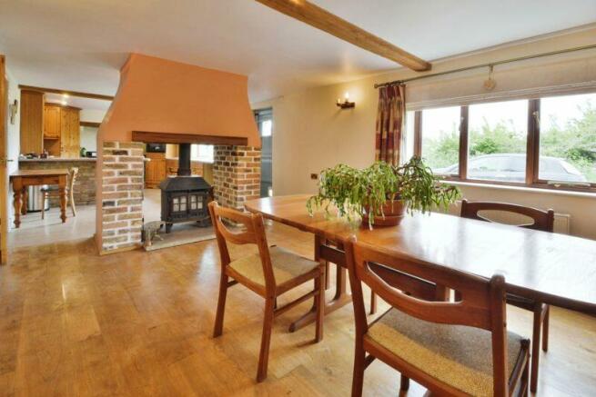 Dining room with double sided log burner