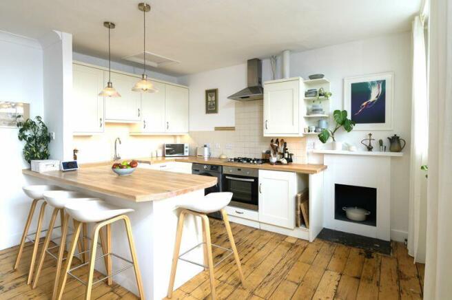 Open-plan kitchen with breakfast table