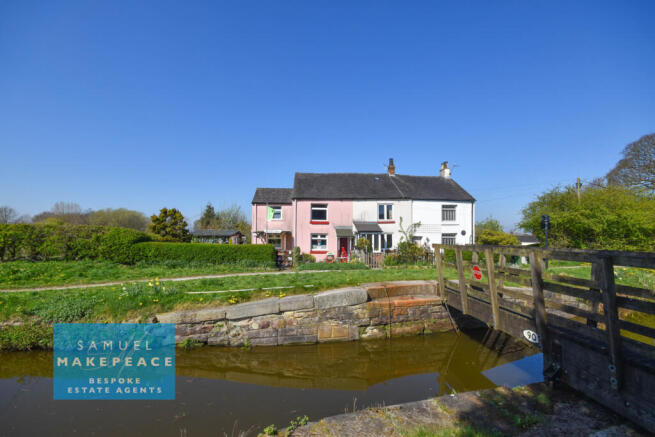 Three Bedroom Cottage with Front Line Canal Views
