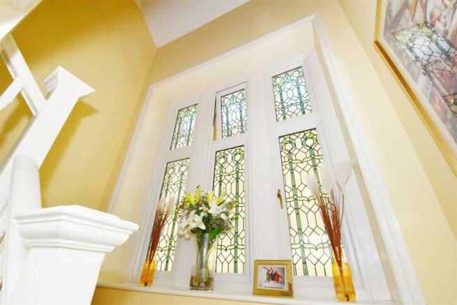 Stained glass window over stairs.jpg