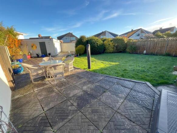 Rear garden, patio and garage.jpg