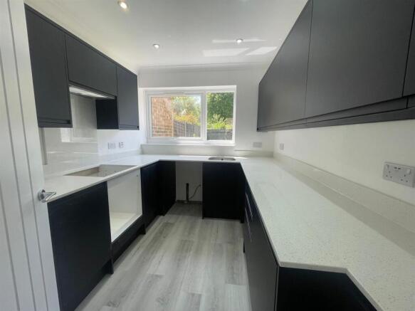 Kitchen with granite surfaces.jpg