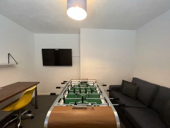 games room and study space with sofa ...