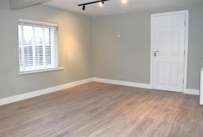 LOUNGE OPEN TO KITCHEN