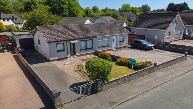 Front Elevation, Drive And Garage