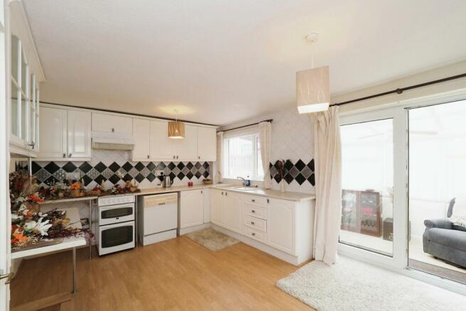 Very spacious Kitchen/Dining space with storage cupboard/pantry and conservatory