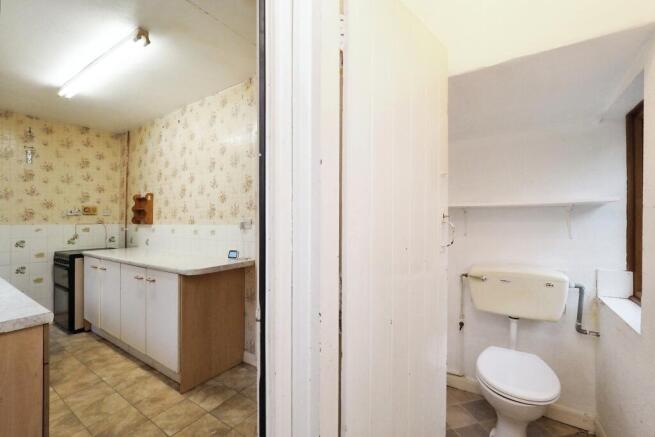 Kitchen and access to downstairs WC