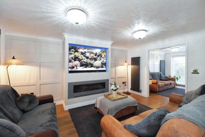 Stylish Lounge, spacious yet cosy with media wall and feature fire