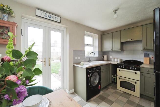 Bright Kitchen and Dining Space with Double Doors