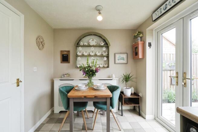 Bright Kitchen and Dining Space with Double Doors