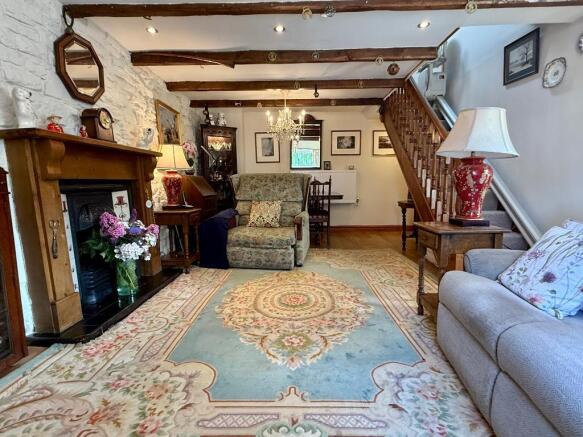 Sitting room with dining table beyond