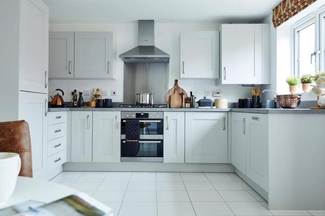 The kitchen offers a hub of the home with space for a dining area