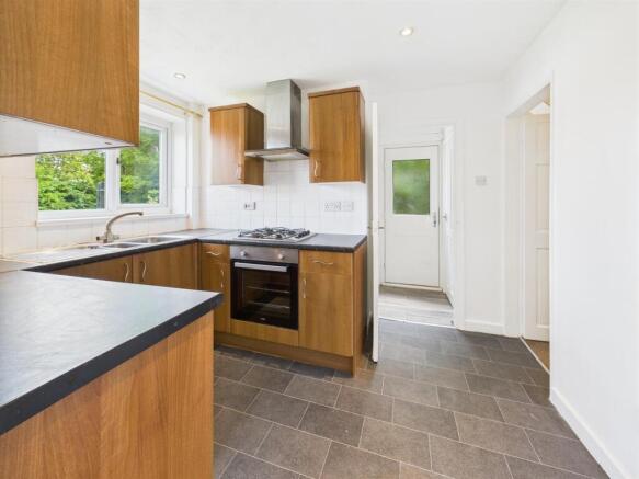 Nicely Fitted Kitchen Through To Utility Area