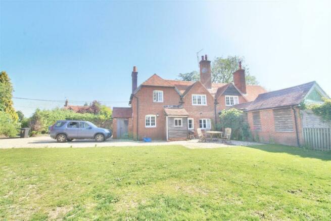 Rear of property with driveway