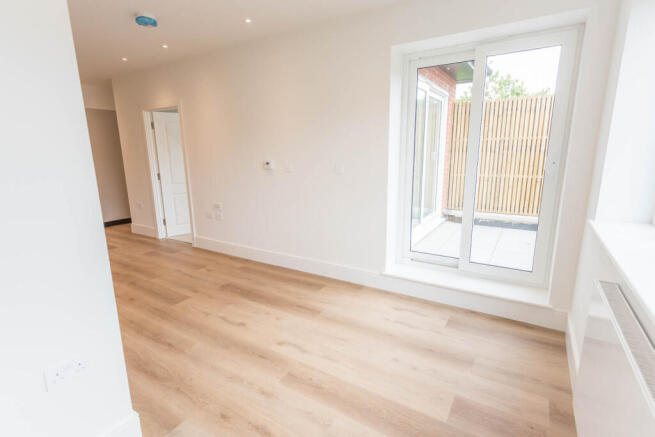 Living Area with doors opening onto balcony