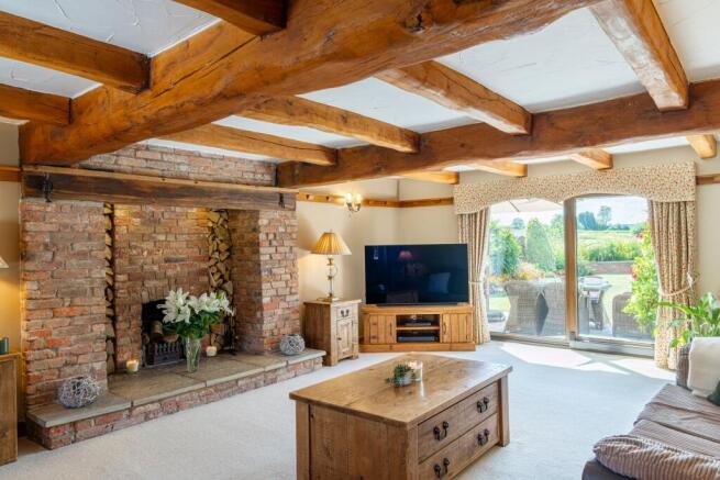 Lounge with dual aspect views to front and back patio