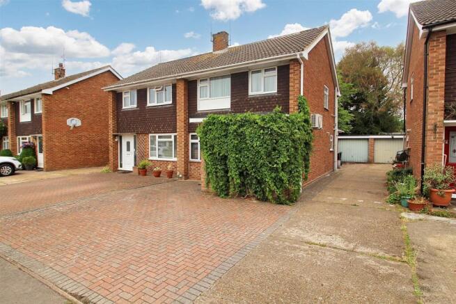 Front with Driveway to Garage