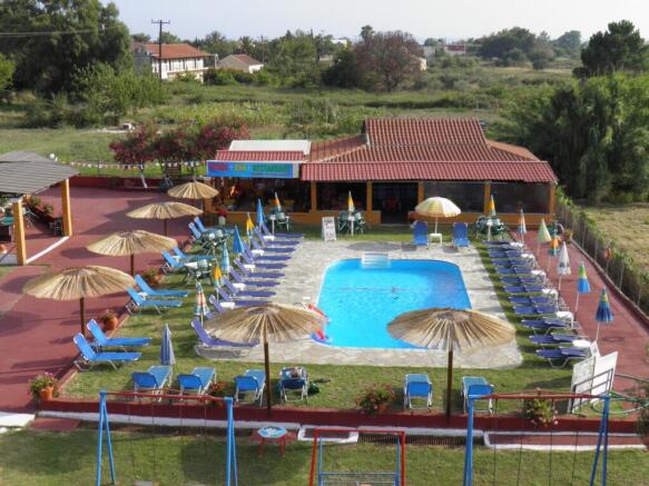 aerial view of pool and buildings