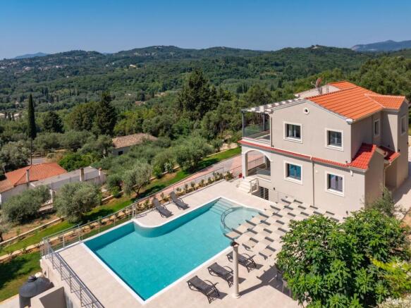 Drone side shot with pool