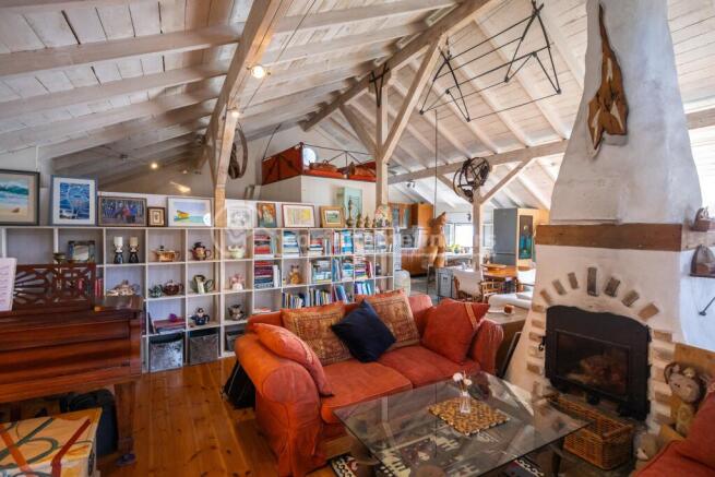 Stairs to sitting and kitchen