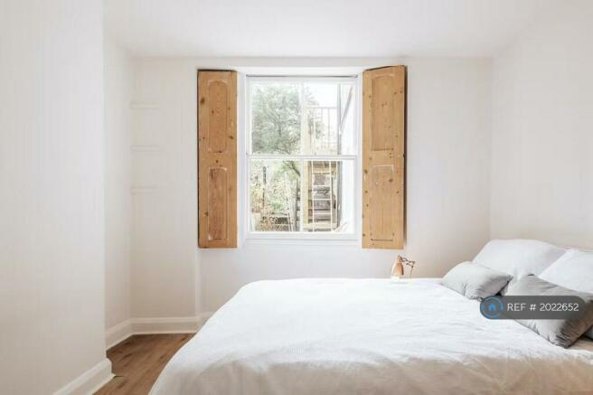 Peaceful Bedroom With Original Victorian Shutters