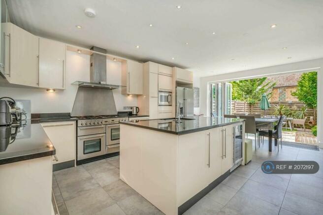 Chef's Kitchen With Doors Onto Patio