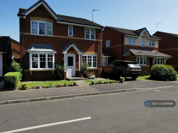 Front Of House With Lovely Gardens