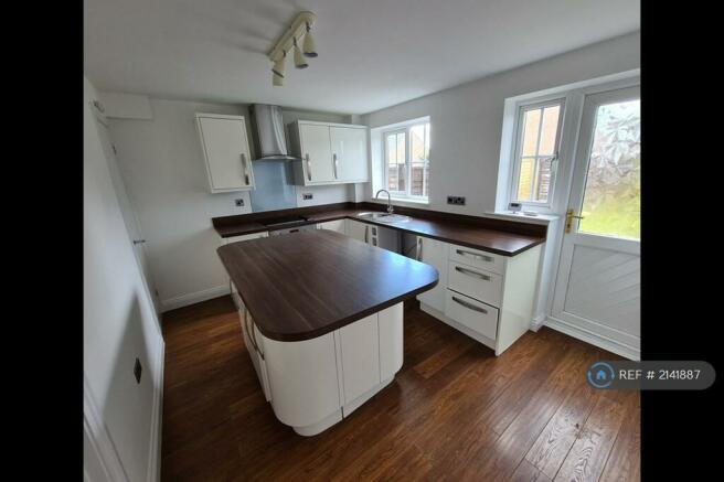 Kitchen With Utility Cupboard Under The Stairs