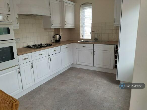 Kitchen With Built In Dishwasher And Washer/Dryer