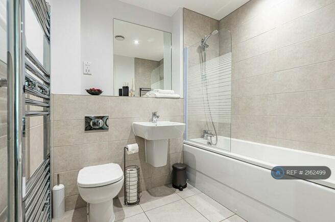 Modern Bathroom With Fresh Towels, Soap, Shampoo