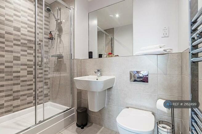 Modern Bathroom With Fresh Towels, Soap, Shampoo