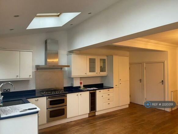 Washing Machine And Dryer In Cupboards