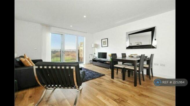 Sitting Room And Dining Area Leading To Balcony