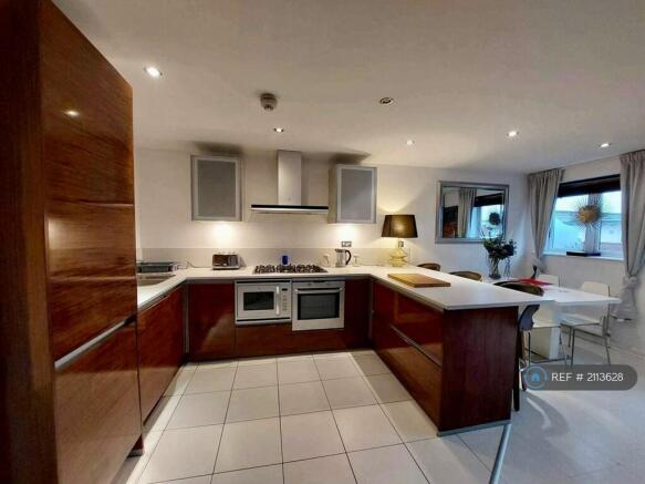 Fully Equipped Kitchen With Breakfast Bar.