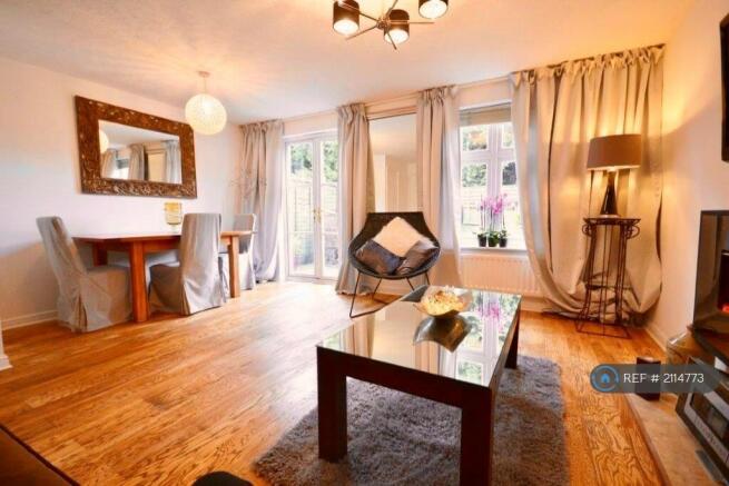 Living Room With Patio Doors Leading To The Garden