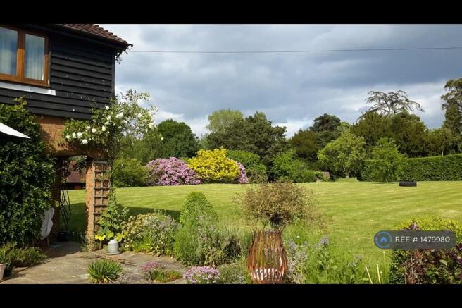 View Across Patio To Gardens