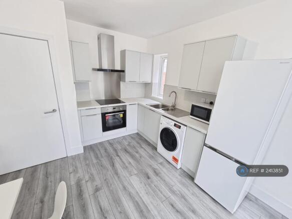 View Of Kitchen From Living Area. 