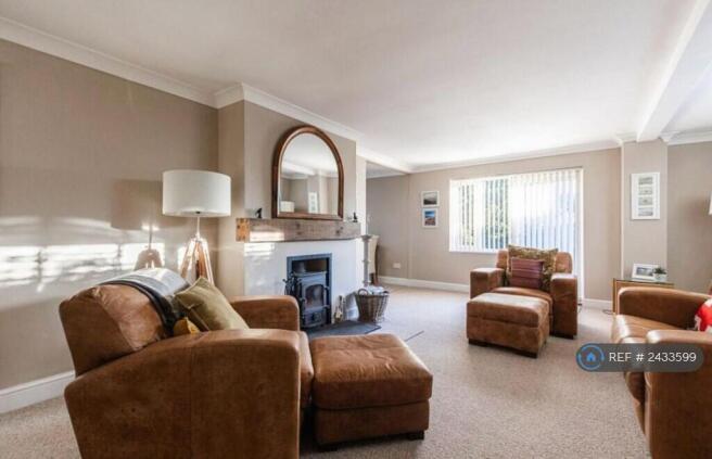 Sitting Room With Log Burner 