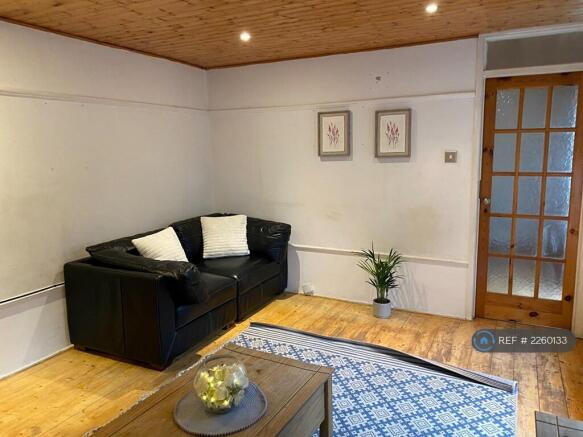 2 Sofas And An Arm Chair