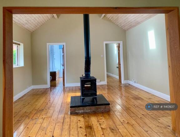 Living Room With Central Wood Burning Stove