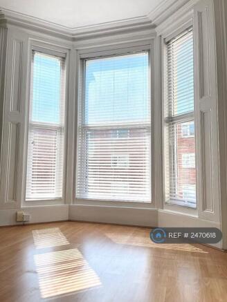 Large Bay Windows With Fitted Wooden Blinds