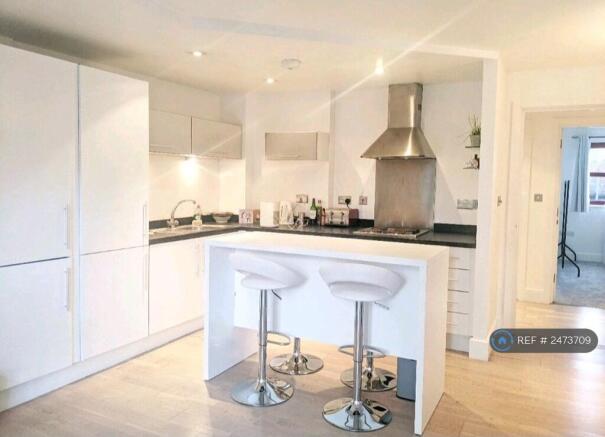 Open Kitchen With 4 Bar Stools