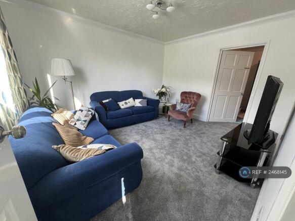 Living Room With Access To Dining And Hallway